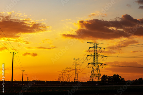 A high-voltage tower at sunset