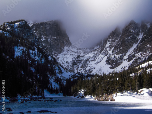 Frozen Dream Lake and snow covered Hallett Peak, Rocky Mountain National Park photo