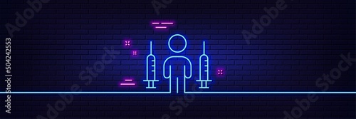 Neon light glow effect. Coronavirus two injections line icon. Corona vaccine syringe sign. Covid jab symbol. 3d line neon glow icon. Brick wall banner. Coronavirus injections outline. Vector