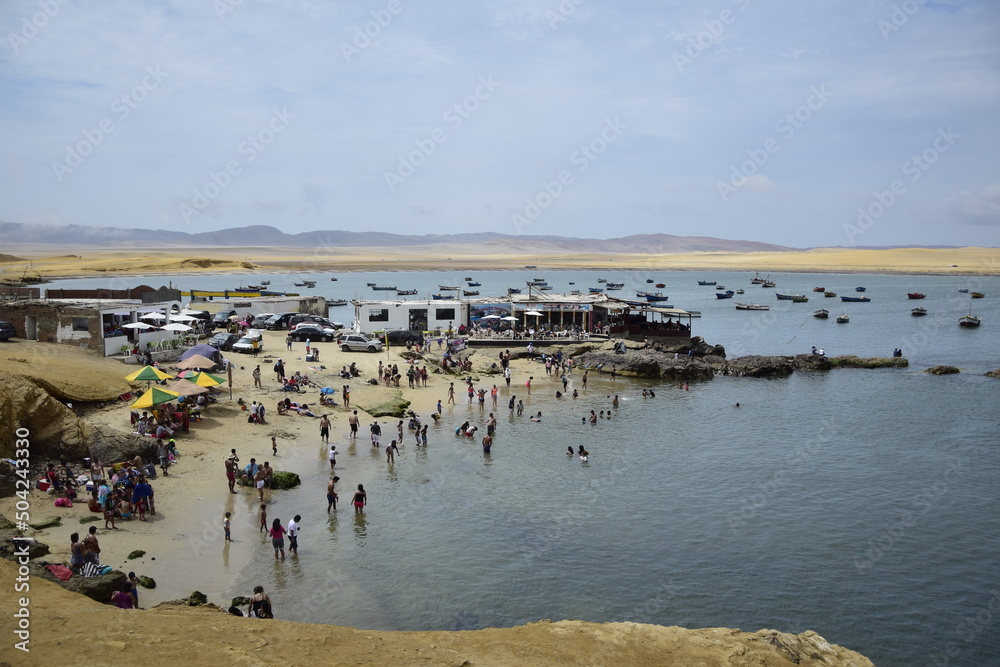 People on a small beach in the Paracas National Park. Peru People on a small beach in the Paracas National Park. Peru