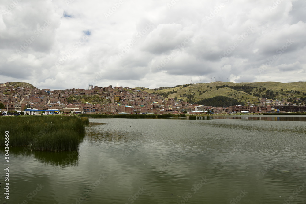 The coast of Lake Titicaca overlooking the city of Puno, Peru