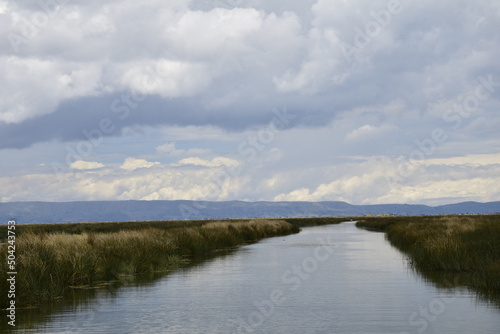 A small waterway on Lake Titicaca to the straw Islands. Puno  Peru. Lake Titicaca South America