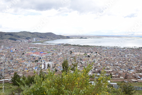 View from a high point of Lake Titicaca and the city of Puno, Peru © Андрей Поторочин