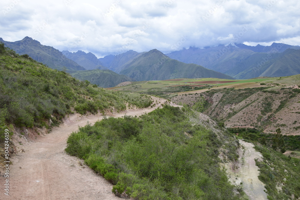 The road between the mountains to the salt terraces of Maras in the Andes mountain range in the region of Cusco, Peru