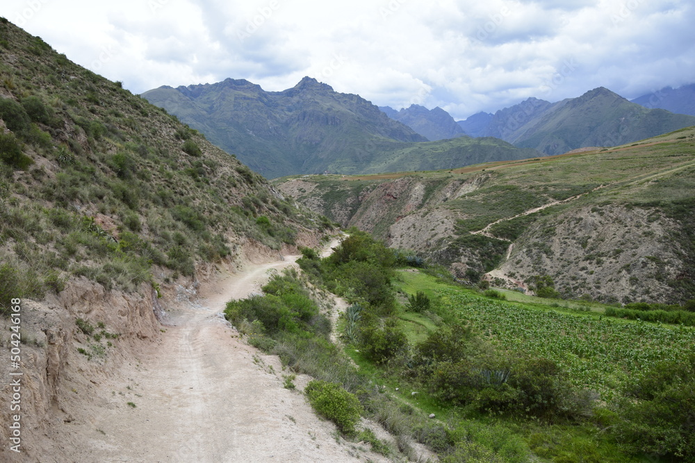 The road between the mountains to the salt terraces of Maras in the Andes mountain range in the region of Cusco, Peru