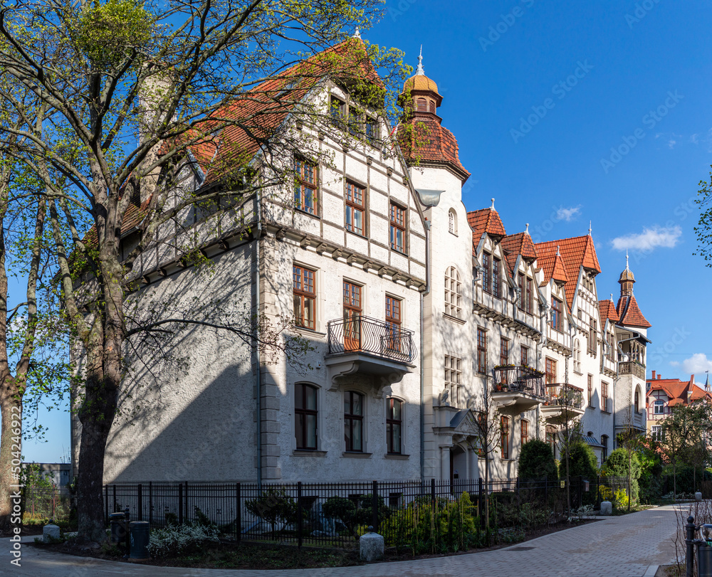 Fototapeta premium Old mansion in the garden in spring