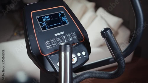 digital console screen of elliptical cross trainer machine, heart rate sensor