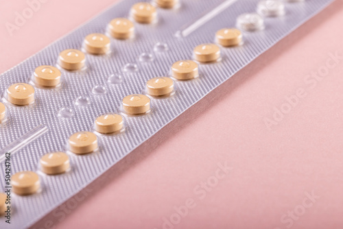 High angle close-up of blister pack of medicines isolated against pink background  copy space