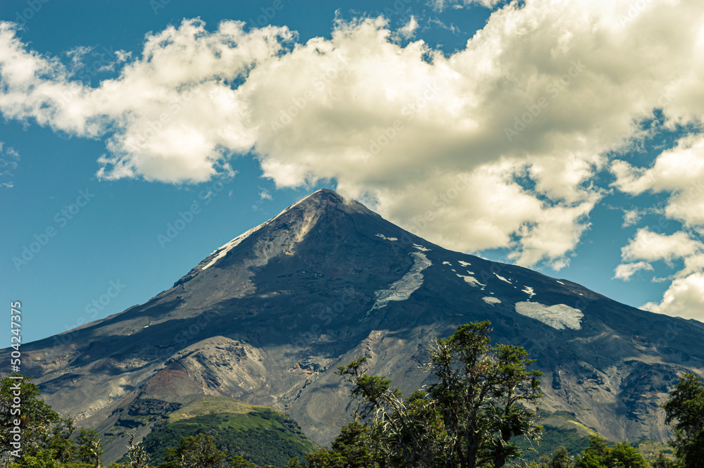 Lanin volcano in the background with forests and meadows in its surroundings on a beautiful day. Neuquen, Argentina Lanin volcano in the background with forests and meadows in its surroundings on a beautiful day. Neuquen, Argentina
