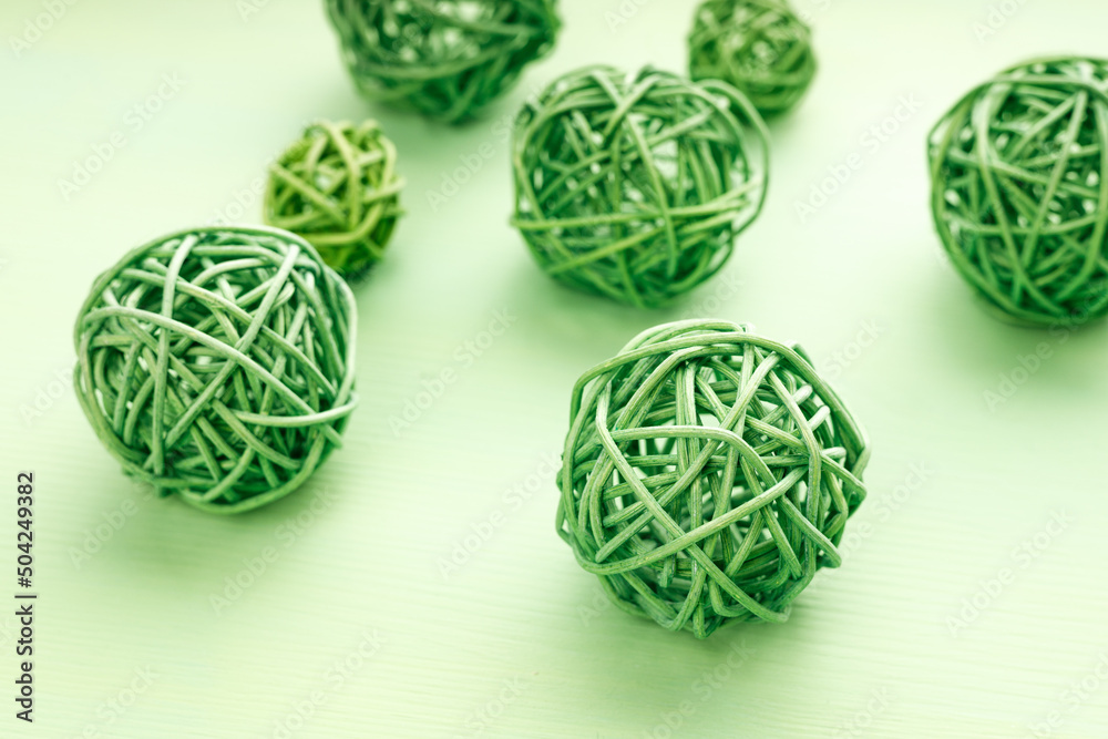 green wicker balls in perspective on a green background green wicker balls in perspective on a green background