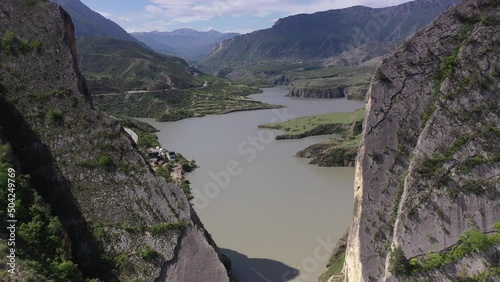 panoramic view of the Caucasus mountains gorges ancient fortresses and curved mountain roads on a spring day