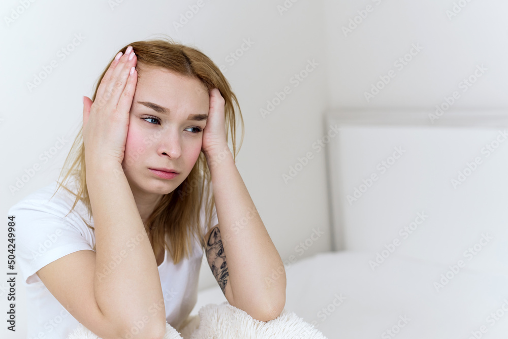 Woman with hard headache holding hands on head