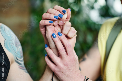 Принти на полотні Horizontal close-up shot of unrecognizable woman in love holding hand of her hus
