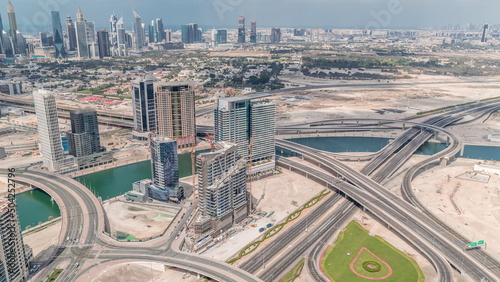 Highway intersection and skyscrapers in business bay and financial district of Dubai aerial timelapse.