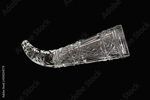 crystal wine glass, stylized as a ram's horn on a black background. Such a glass of wine was brought to the guest of honor and he could only drink "to the bottom". soviet fashion for crystal tableware © Olga