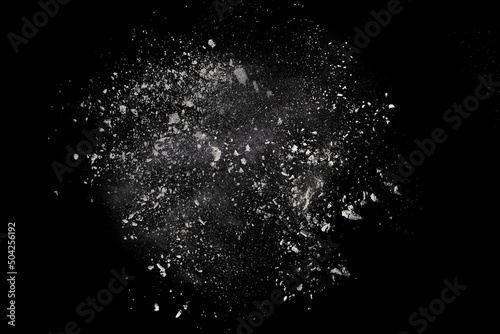 White powder explosion on black background. Colored cloud. Colorful dust explode. Paint Holi. photo