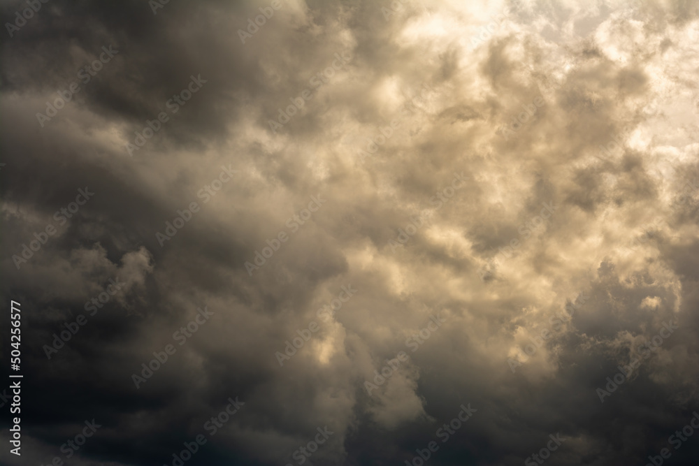 dramatic mystical sky with dense clouds and back sunlight. artistic picture for the original background, layout or decoration