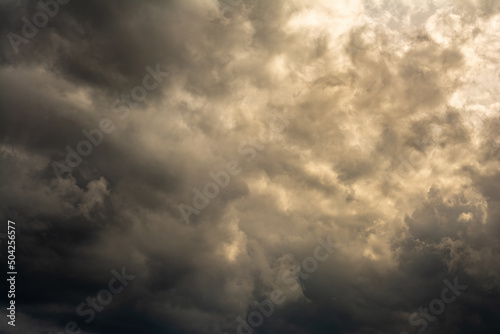 dramatic mystical sky with dense clouds and back sunlight. artistic picture for the original background, layout or decoration