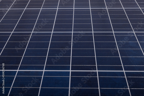 Full frame shot of blue solar panel with white grid patterns, copy space