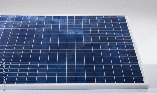 High angle view of blue solar panel with grid patterns isolated against white background, copy space