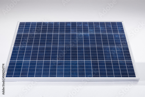 High angle view of blue solar panel with grid patterns isolated over white background, copy space