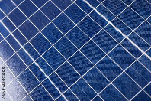 High angle full frame shot of white grid patterns on blue solar panel, copy space
