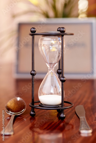 hourglass on a wooden table