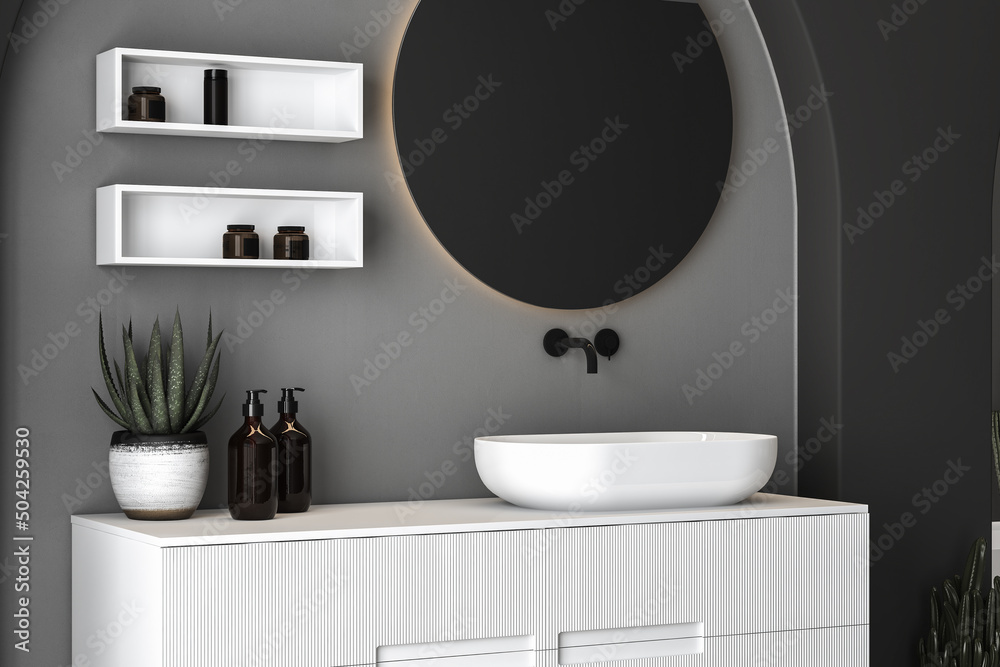 Close up of sink with oval mirror standing in on concrete wall, white cabinet with black faucet in minimalist bathroom. Mock up, stand. Side view. 3d rendering
Close up of sink with oval mirror standing in on concrete wall, white cabinet with black faucet in minimalist bathroom. Mock up, stand. Side view. 3d rendering