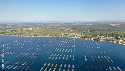 survol des parcs à huitres à Sète au dessus du bassin de Thau en Occitanie photo
