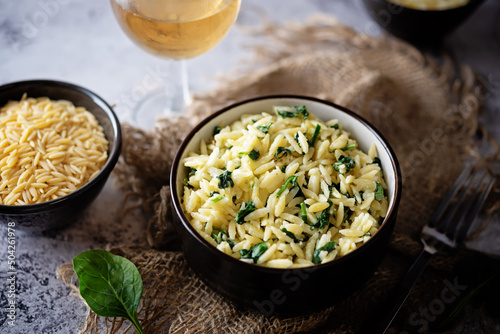 Creamy spinach cheesy orzo photo
