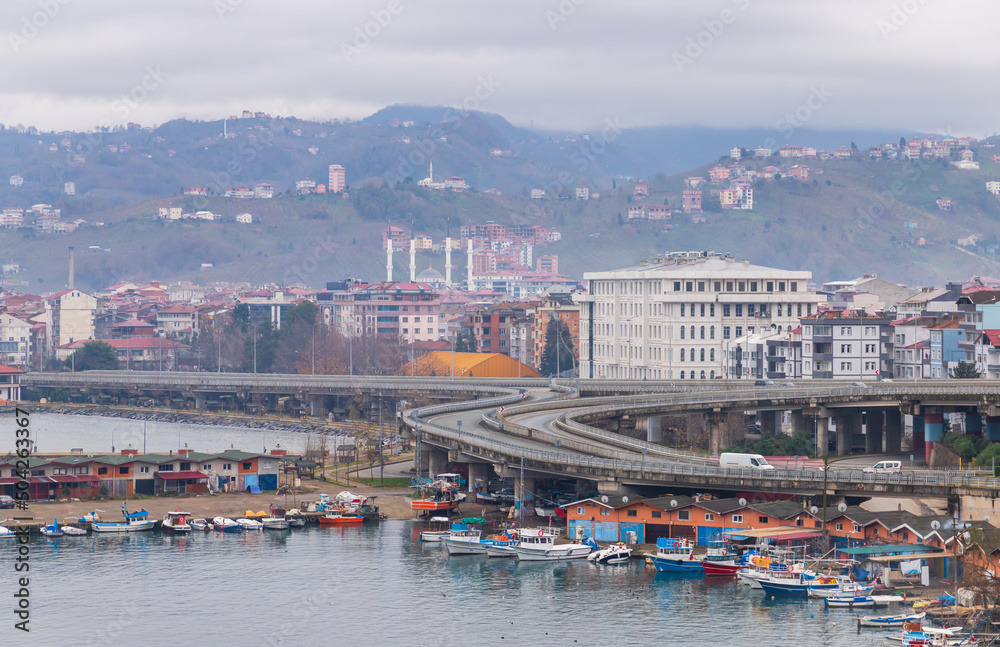 Coastal view with boats and highway of Arakli, Trabzon, Turkey