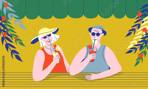 Elderly couple drinking cocktails in street cafe or beach bar. Relationships and friendships of older people. Senior man and woman spending time together and enjoy summer vacation in tropical country