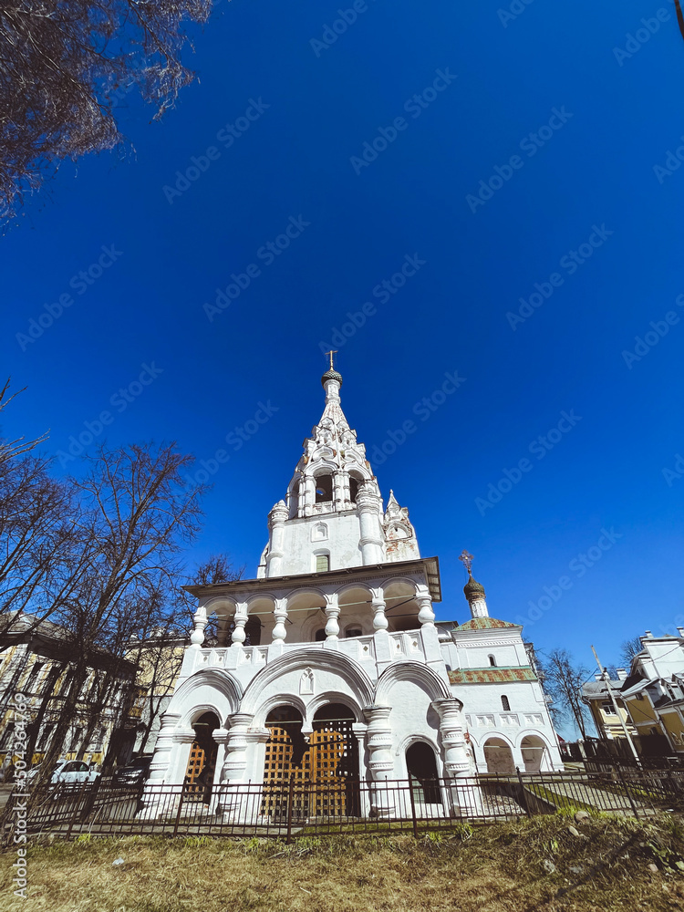Beautiful orthodox church with white walls, blue sky background