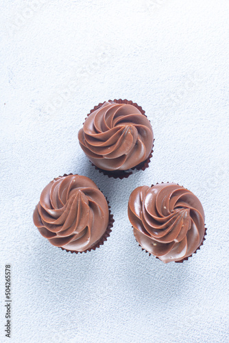 Rum flavored chocolate cupcake displayed on gray background