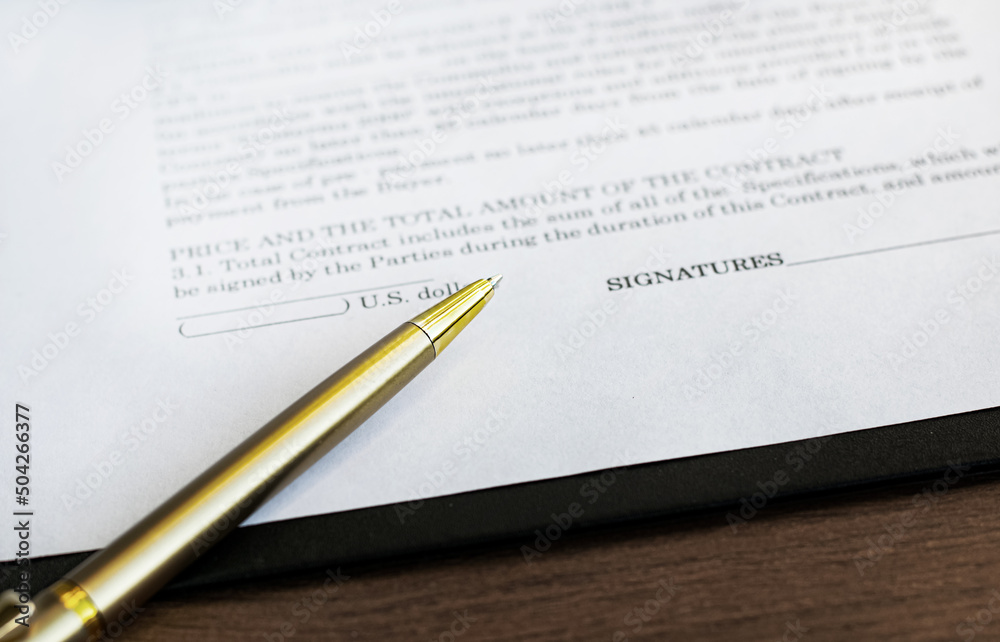 Business contract and pen on the table. Business and finance concept. Selective focus. Business contract and pen on the table. Business and finance concept. Selective focus.