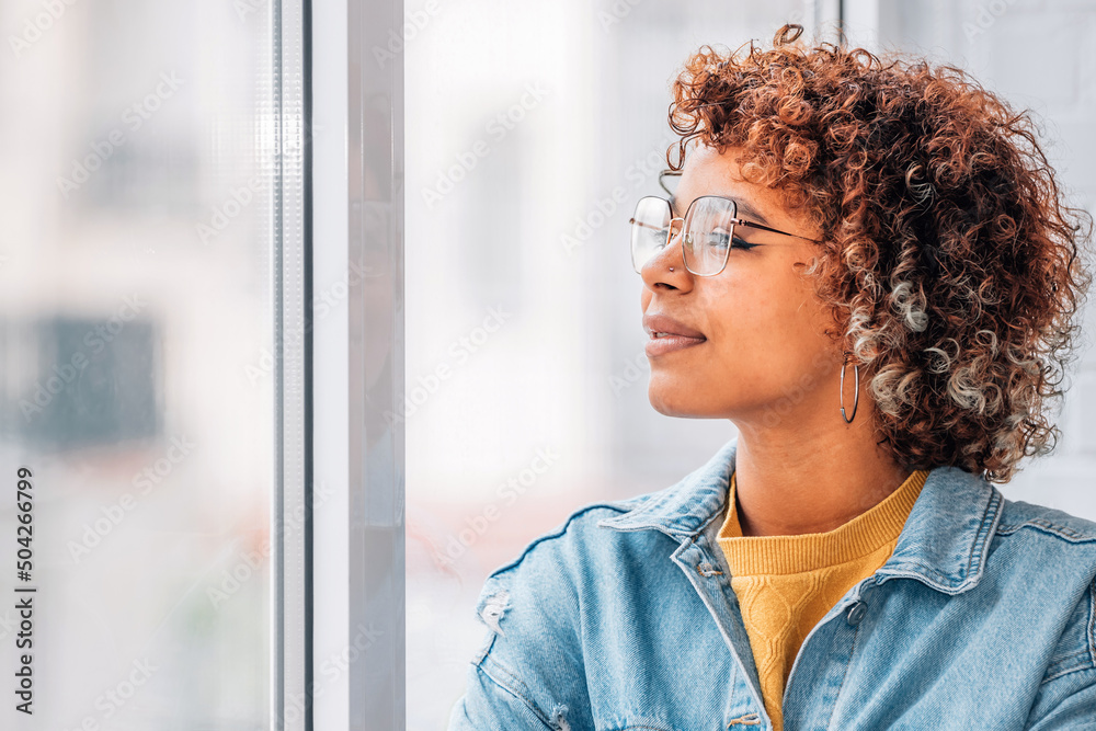 © carballo - pensive girl or woman looking out the window © carballo - pensive girl or woman looking out the window