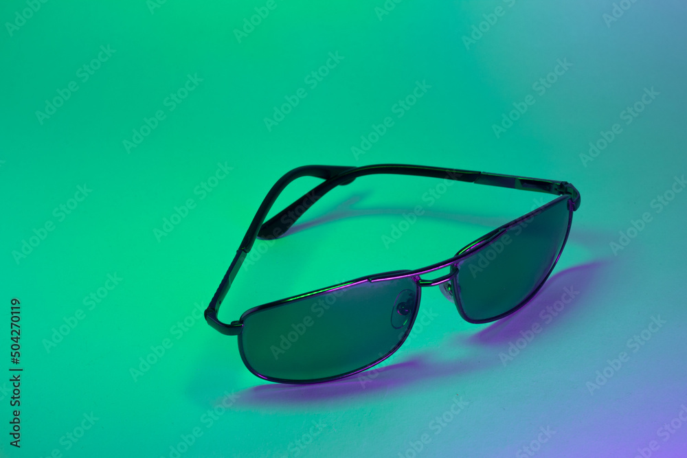 Isolated sunglasses on colored background Isolated sunglasses on colored background