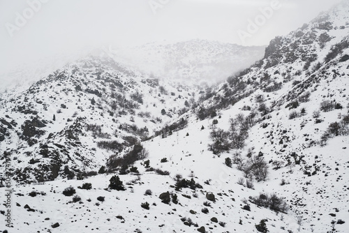 Landscape View of snowy mountains and hills from train trip and in central anatolia.
