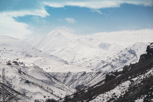 Landscape of a mountain with snow and clouds