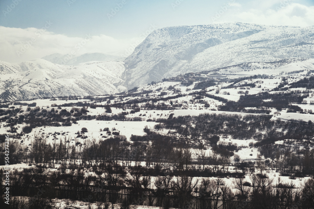 Landscape of a mountain with snow and clouds