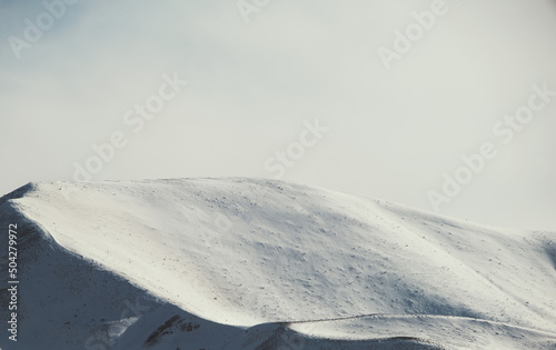 Landscape of  mountains with snow and some clouds © ardasavasciogullari