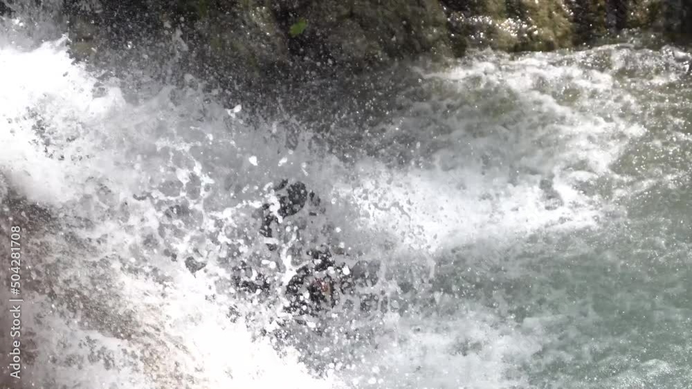 custom made wallpaper toronto digitalCloseup of a stream of water over a rock and a person taking a bath. Clean water flows over the rocks into the river. recorded at Kedung Pedut Waterfall, Yogyakarta, Indonesia.