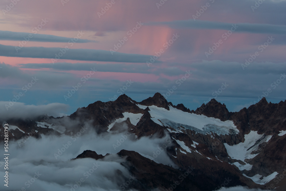 Pink sunrise over Twin Sisters, North Cascades, Washington from Mount Baker National Recreation Area
