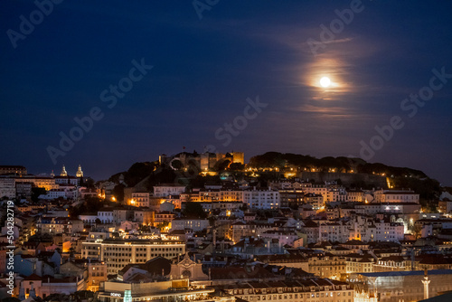 Moonrise over Lisbon, Portugal from the Miradouro de São Pedro de Alcântara photo