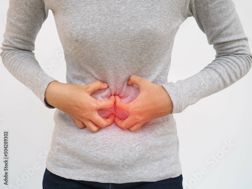 Fotografía Gastroenteritis in an Asian woman and she experiences abdominal pain in the middle of her abdomen and position near the navel