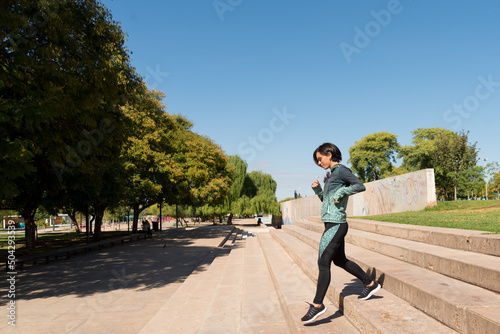 woman in sportswear walking down stairs. Activity and good health. Active lifestyle concept. selective focus.