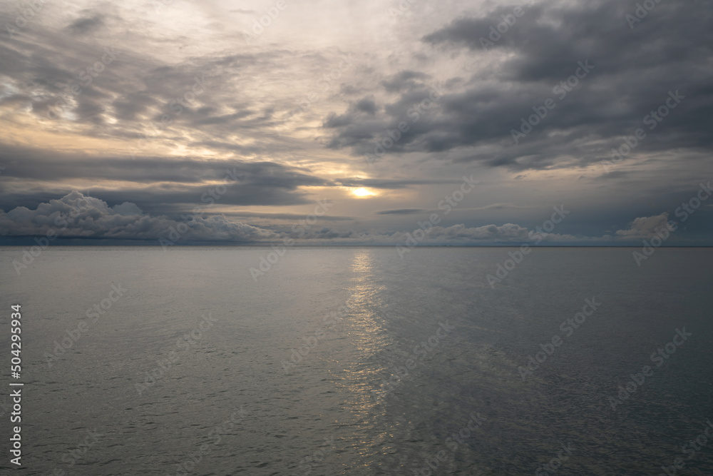 View of the Black Sea on the coast of Sochi against the sunset sky, Sochi, Krasnodar Krai, Russia