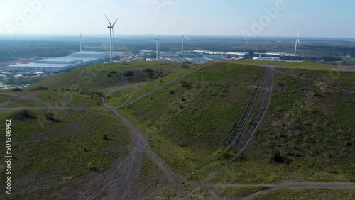 Beautiful mining terril with wind turbines behind, aerial drone view photo