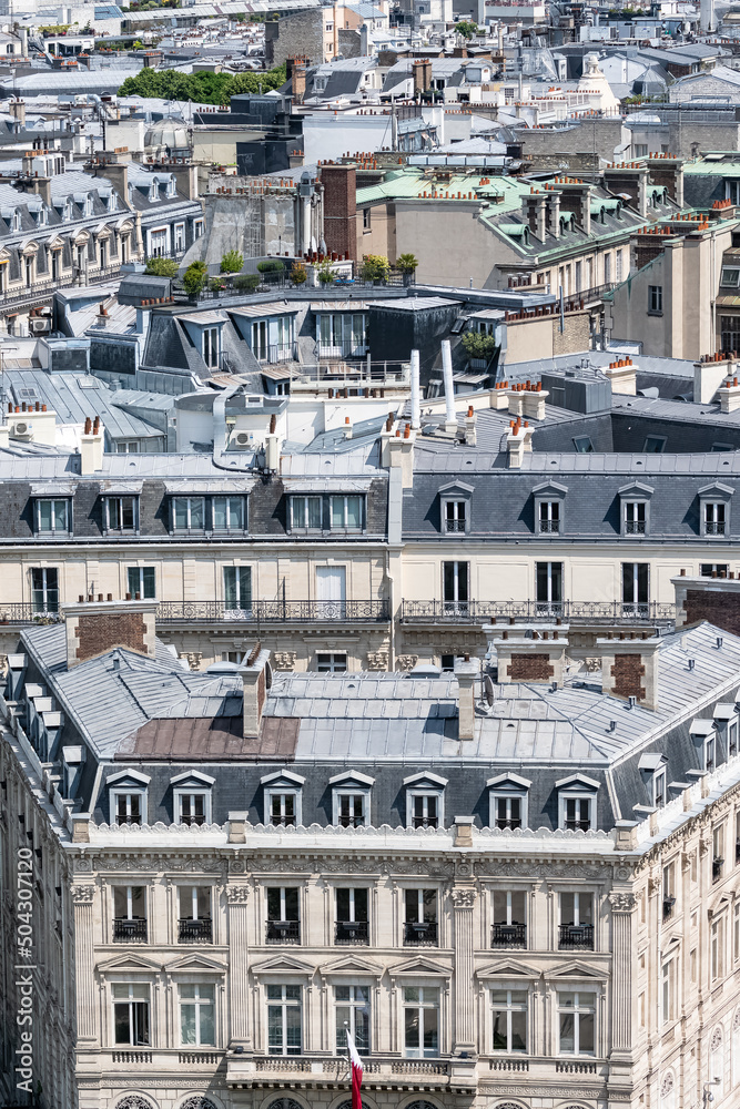 Paris, beautiful Haussmann facades and roofs in a luxury area of the capital, view from the triumph arch
