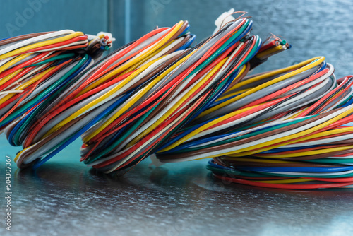 Color cable scrap coils on metallic background